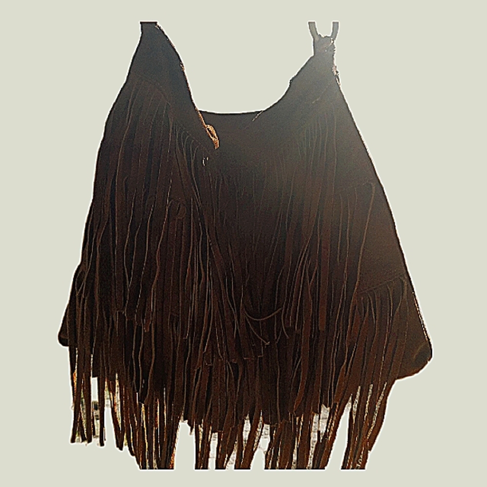 A purse woman's brown medium size purse with strips of leather